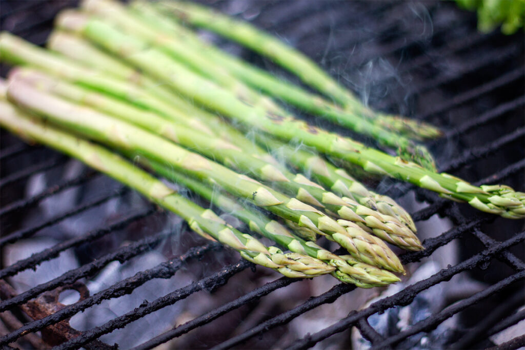 grilling asparagus on a barbecue