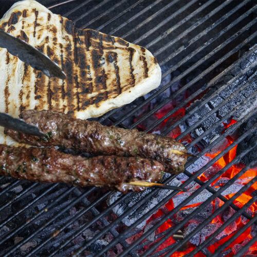 barbecuing lamb kofta kebabs