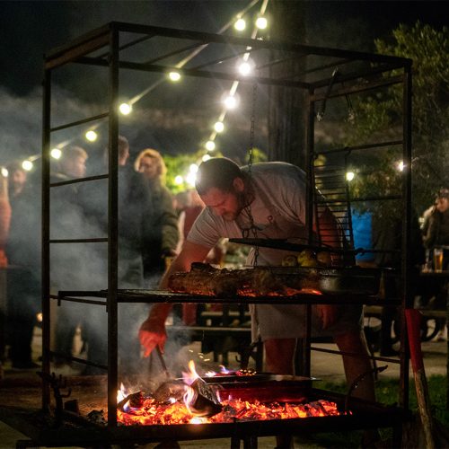 chef rupert cooper of philleigh way cookery school cooking a bonfire night feast over fire at knightor winery