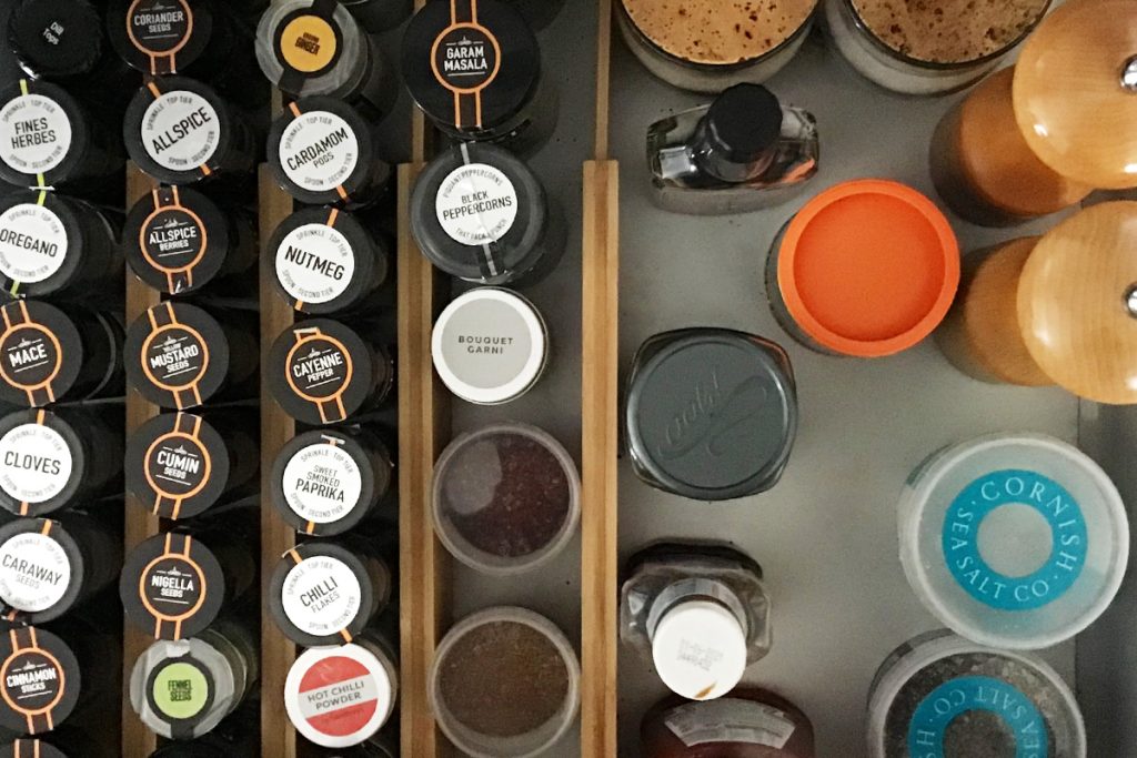 contents of a kitchen spice drawer
